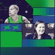 Courtney Williams and assistant coach Lindsay Whalen pictured in green, blue and navy colors.