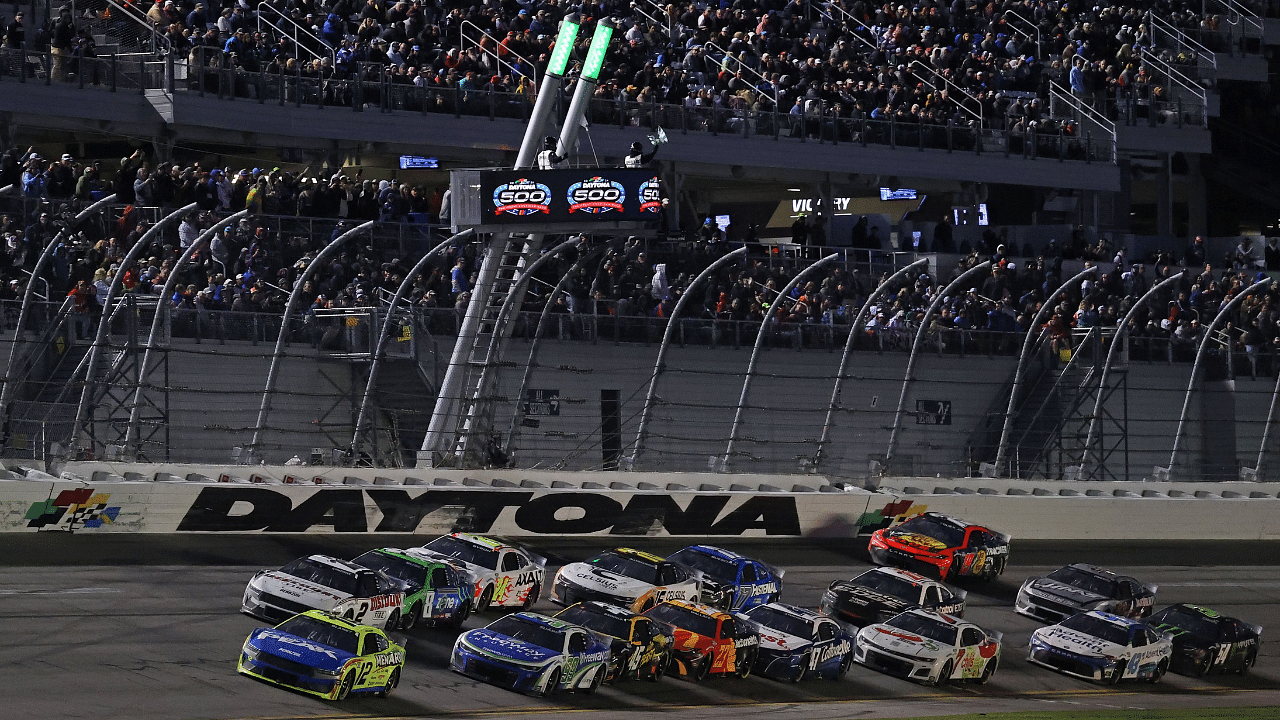 NASCAR Cup Series driver Michael Waltrip (15) walks through the garage area during practice for the Daytona 500 at Daytona International Speedway.