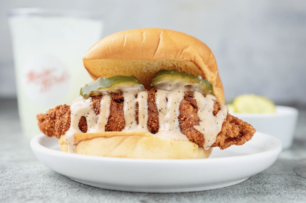 Main Bird opened its seventh Houston-area restaurant in early August, selling hot chicken to customers. (Courtesy Main Bird via Facebook)