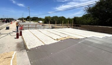 Woman Hollering Creek Bridge in Schertz, Texas is seen under construction during a sunny afternoon.