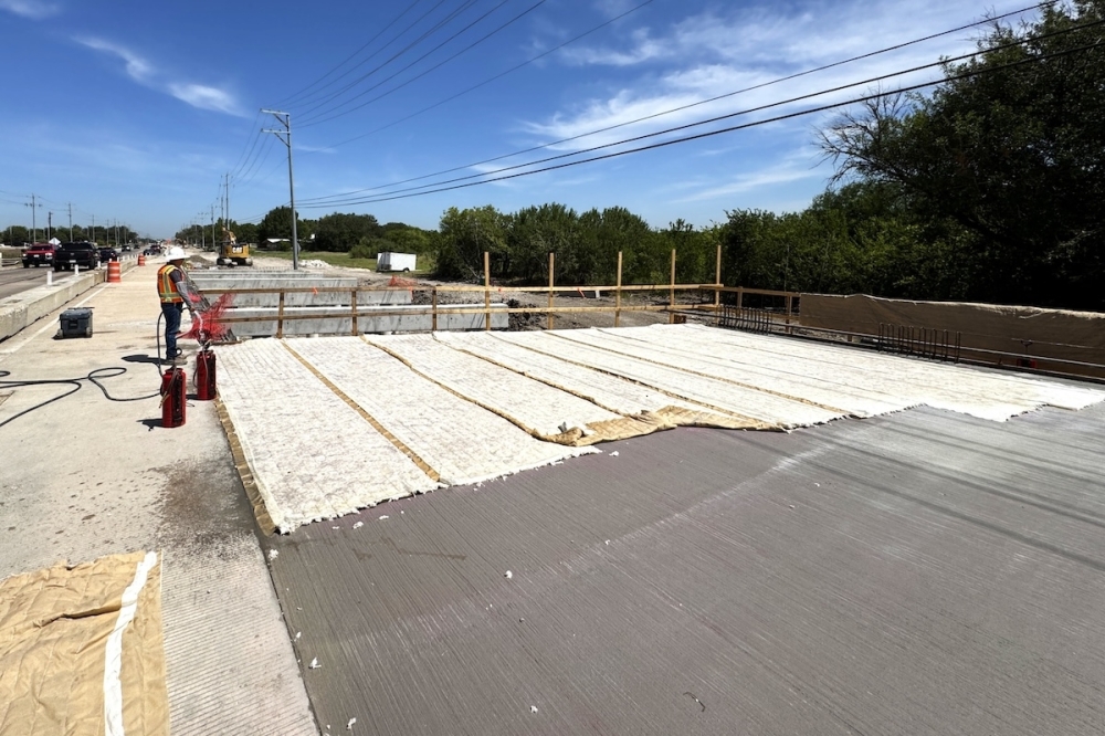 Woman Hollering Creek Bridge in Schertz, Texas is seen under construction during a sunny afternoon.