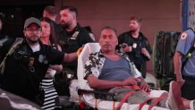 First responders rush a 65-year-old tourist from Colombia to be treated following a shooting in Times Square.
