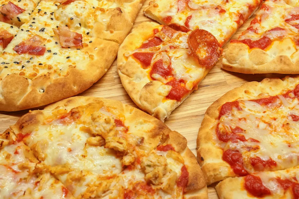 Tim Hortons new flatbread pizza products (clockwise from top left) Bacon Everything, Pepperoni, Simply Cheese, and Chicken Parmesan are photographed at the Tim Hortons test kitchen in Toronto on Thursday, April 4, 2024.THE CANADIAN PRESS/Chris Young
