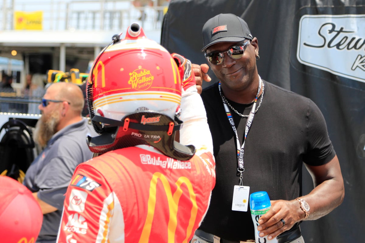 An image of 23XI owner Michael Jordan with driver Bubba Wallace