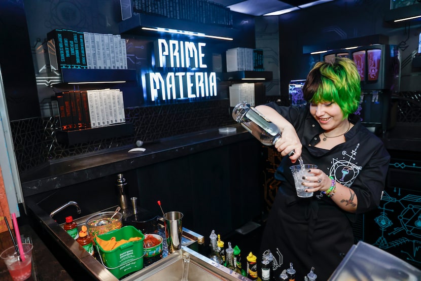 Jack McPherson prepares a drink during a media preview for Meow Wolf Grapevine's new bar...