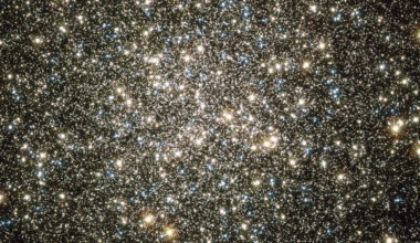 A mass of gold and blue stars are pictured shining against the blackness of space.