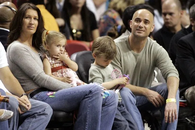Eliot J. Schechter/Getty Images Steffi Graf with her husband Andre Agassi and their children watch an NBA game on January 22, 2006 in Miami, Florida.