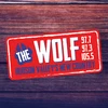 97.7/97.3 The Wolf logo
