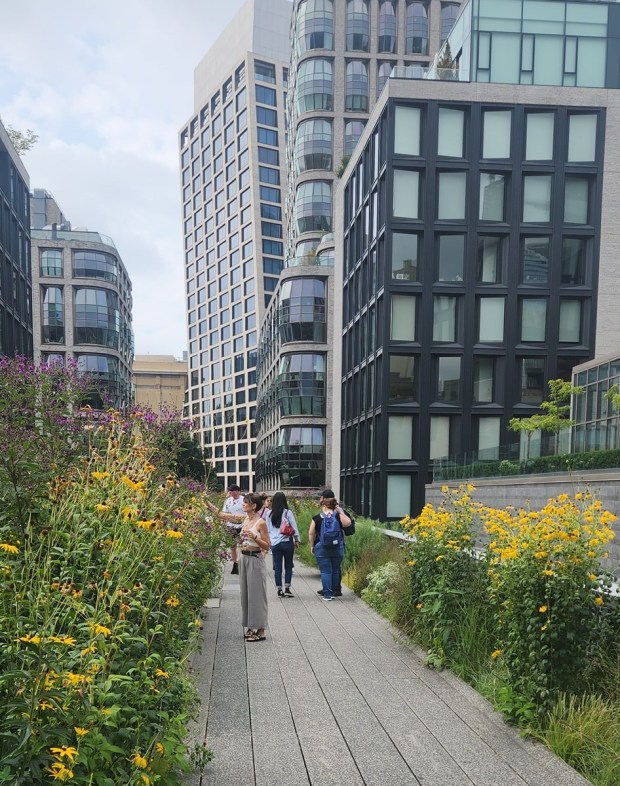 Tourists and locals alike enjoy walking the converted tracks of the High Line in NYC. (BILL RETTEW/MEDIANEWS GROUP)