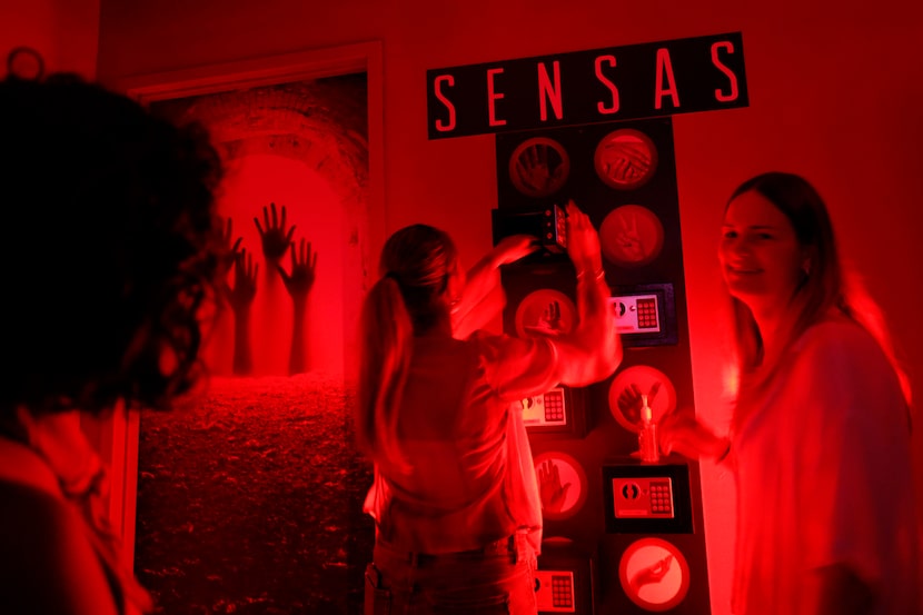 Andrea Seanez of El Paso opens a locker and takes out a token as Aileen Wiebe of Dallas...