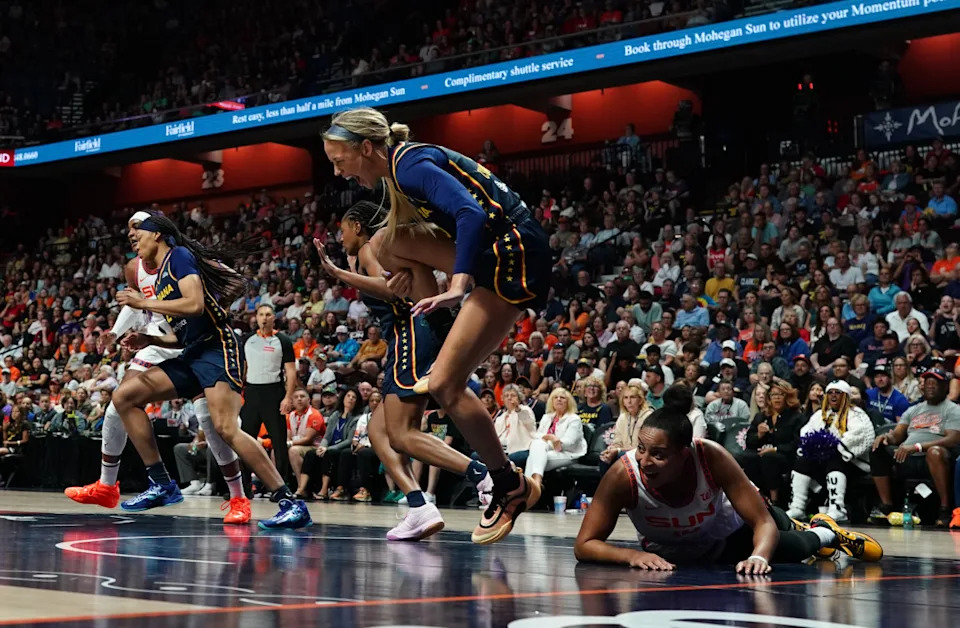 Aug 17, 2025; Uncasville, Connecticut, USA; Indiana Fever guard Sophie Cunningham (8) is injured on a play against Connecticut Sun guard Bria Hartley (14) in the first half at Mohegan Sun Arena. Mandatory Credit: David Butler II-Imagn Images© David Butler II-Imagn Images