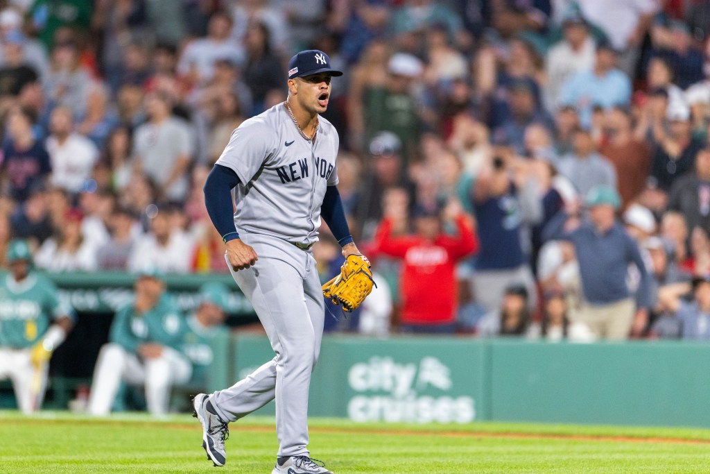 New York Yankees pitcher celebrates after ending an inning.
