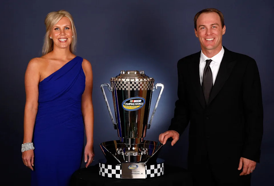 Team owners Kevin Harvick (R) and wife DeLana Harvick pose with the 2009 Camping World Truck Series trophy.