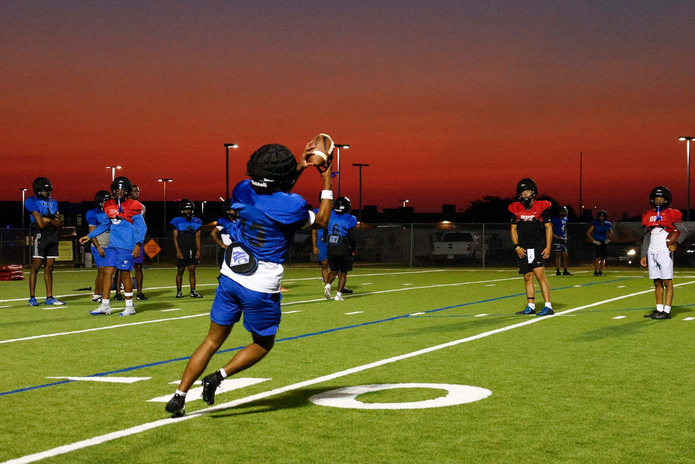 A North Crowley wide receiver makes a catch as they install new plays during the first day...