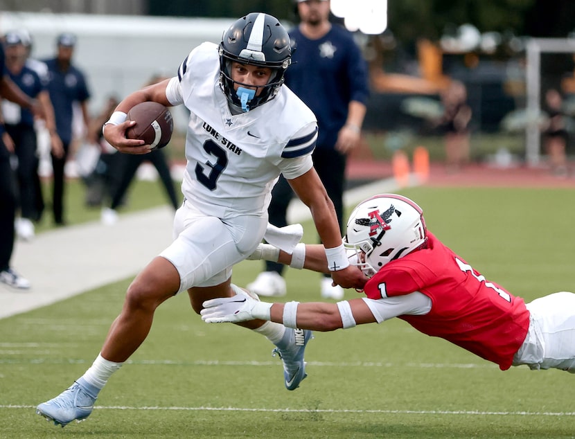 Frisco Lone Star quarterback Trey Wright (3) eludes a tackle from Argyle defensive back...