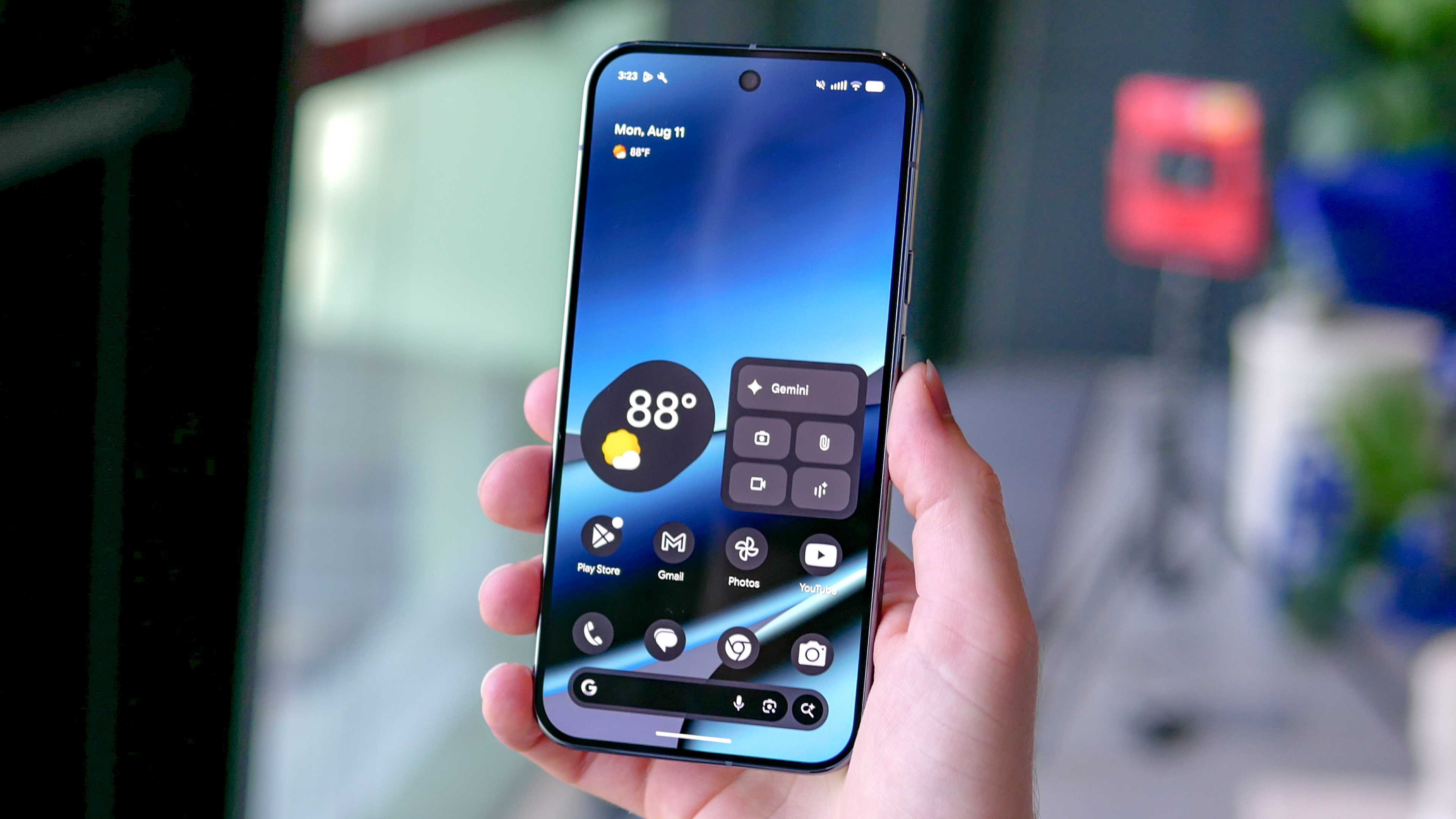 Google Pixel 10 Pro XL held in the hand showing Android 16 home screen.