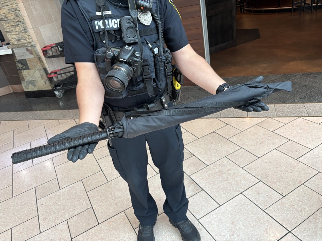 Police said a black umbrella with a samurai-style handle was mistaken for a rifle, sparking panic at Destiny USA.