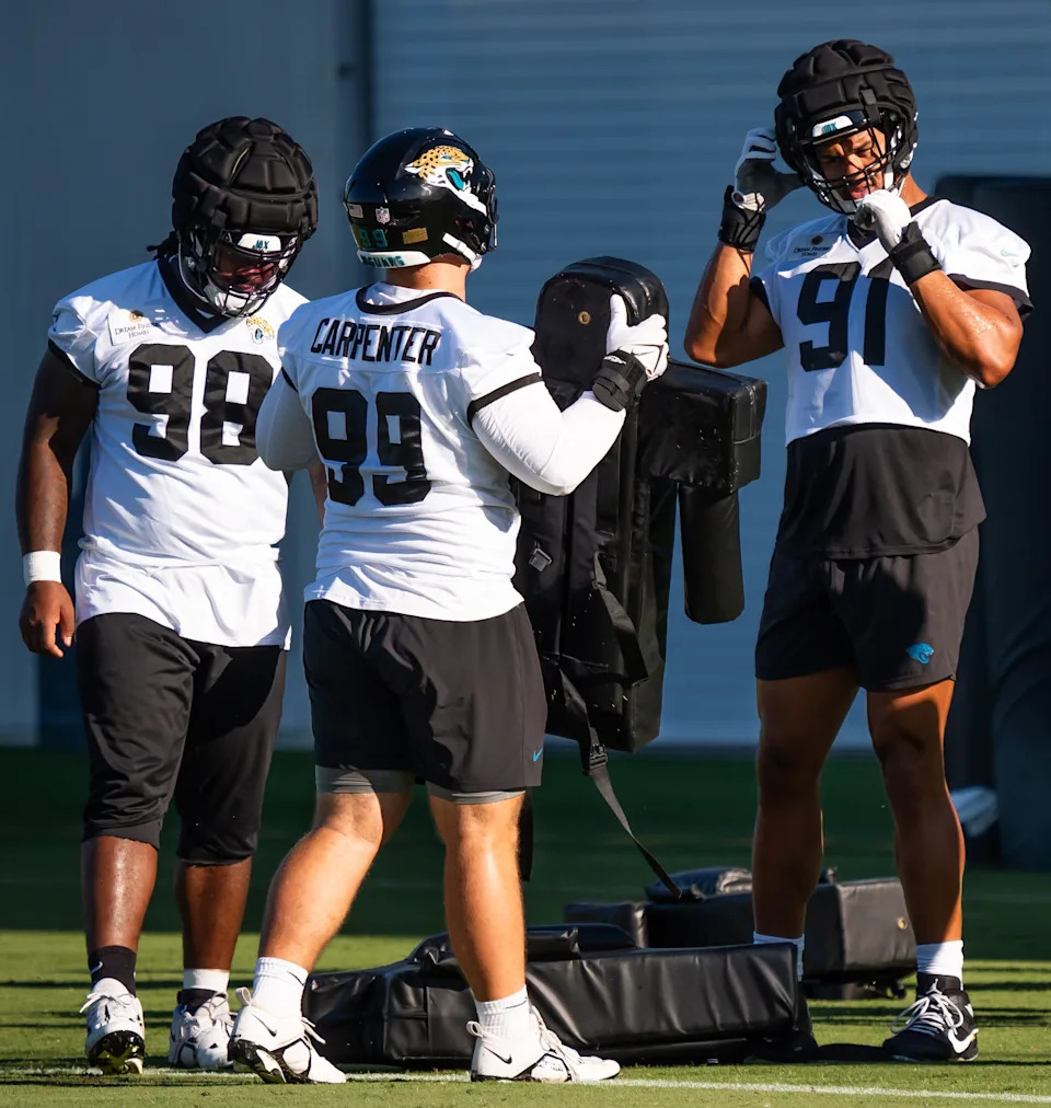 Jacksonville Jaguars defensive end Arik Armstead (91) buckles up his helmet during an NFL training camp second session at the Miller Electric Center, Thursday, July 24, 2025, in Jacksonville, Fla. [Doug Engle/Florida Times-Union]