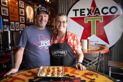 Owners Jill Grobowsky Bergus and Jeff Bergus pose with the brisket deviled eggs at Lockhart...