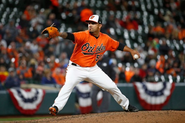 Baltimore Orioles relief pitcher Nestor Cortes Jr. throws to the Minnesota Twins in the seventh inning of a baseball game, Saturday, March 31, 2018, in Baltimore. It was his major league baseball debut. (AP Photo/Patrick Semansky)