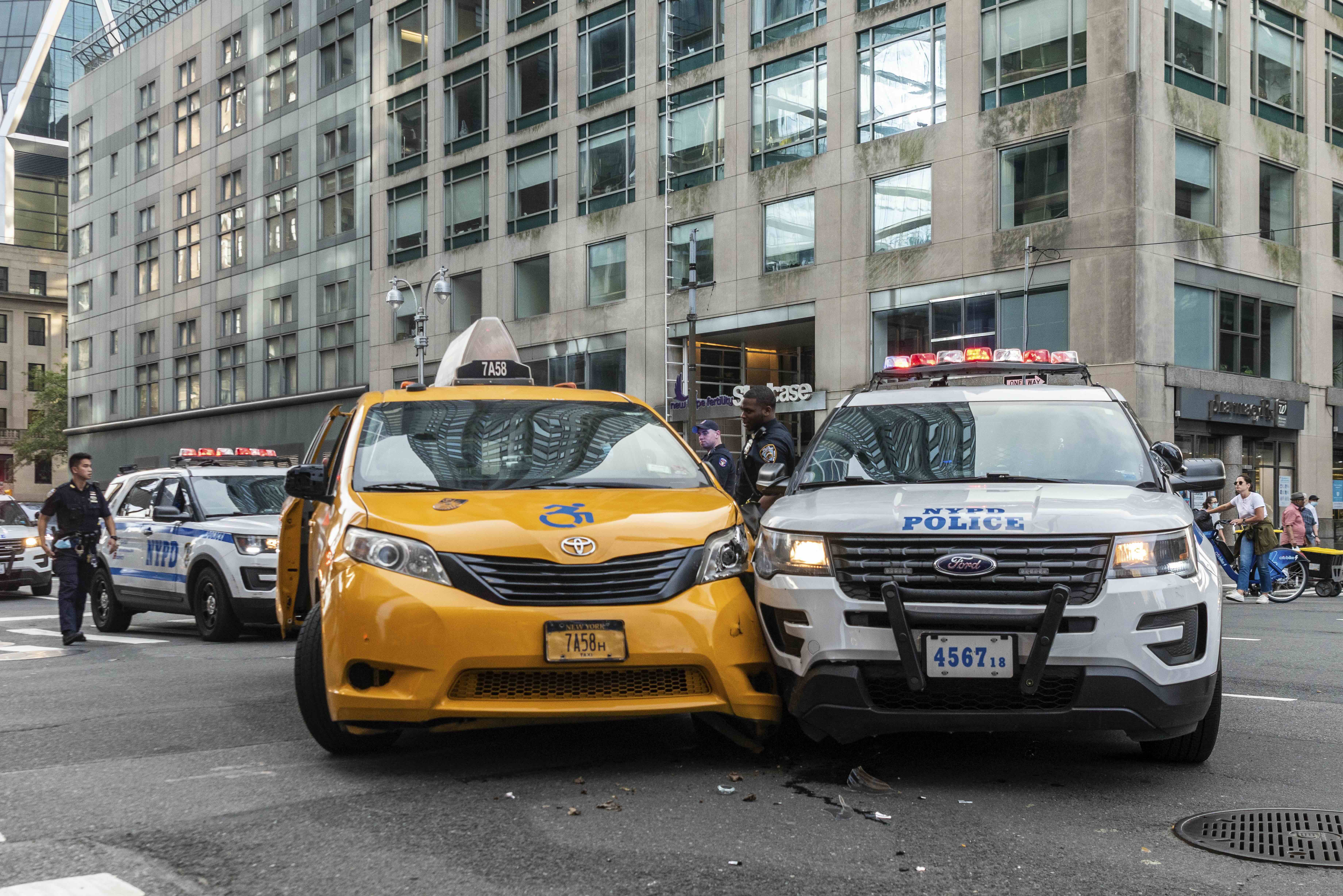 An NYPD cruiser and a yellow cab collide on Broadway and 58th Street in Manhattan on September 13, 2020. (Photo by Gabriele Holtermann/Sipa USA)(Sipa via AP Images)