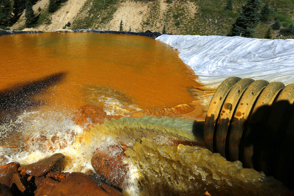 Water in a river appears orange.