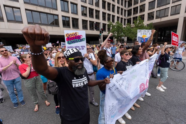 Free DC activists gather outside federal court in Washington, Friday, Aug. 15, 2025, in Washington. (AP Photo/Alex Brandon)