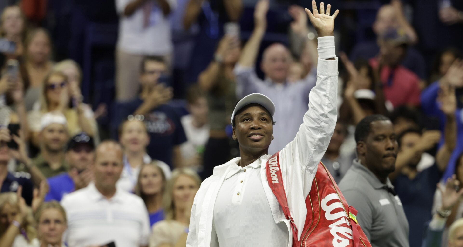 Venus Williams waves to fans