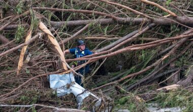 First responders from College Station Fire Department search along the banks of the Guadalupe River, as rescue efforts continue following extreme flooding, July 6, 2025, in Ingram, Texas. (AP Photo/Rodolfo Gonzalez)