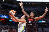 Dallas Wings forward Maddy Siegrist (20) shoots in front of Indiana Fever forward Damiris...