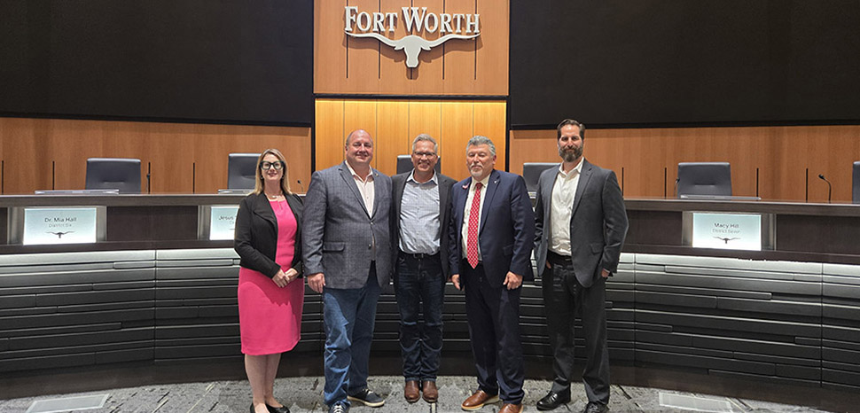 Motion carries: Kelly Baggett, Fort Worth Innovation Coordinator; District 10 Councilmember Alan Blaylock; John Lauer, Founder and CEO of Adom Industries; City Manager Jay Chapa; and Michael Hennig, Economic Development Manager, in chambers after Fort Worth City Council unanimously approved $15 million in incentives for Adom's $229 million cloud-connected electronics factory Tuesday night.