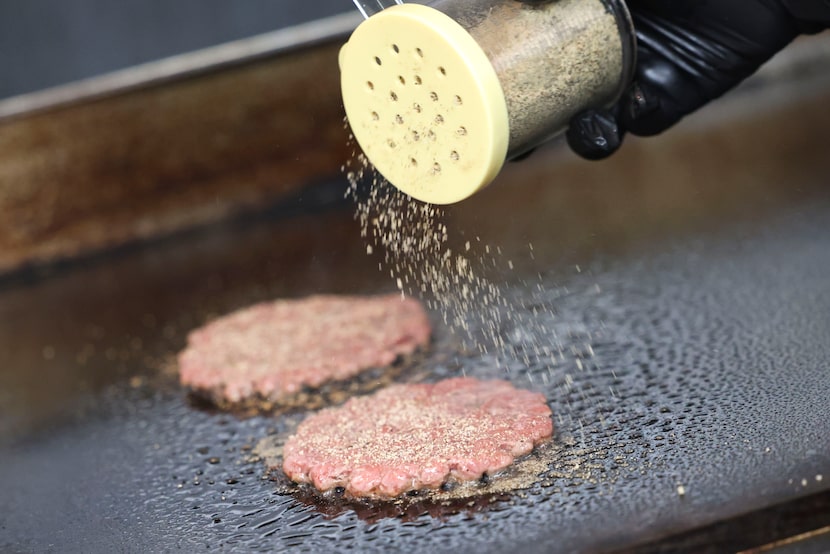 Each flattened patty is seasoned with Neen Williams' "OG steak" spice blend.