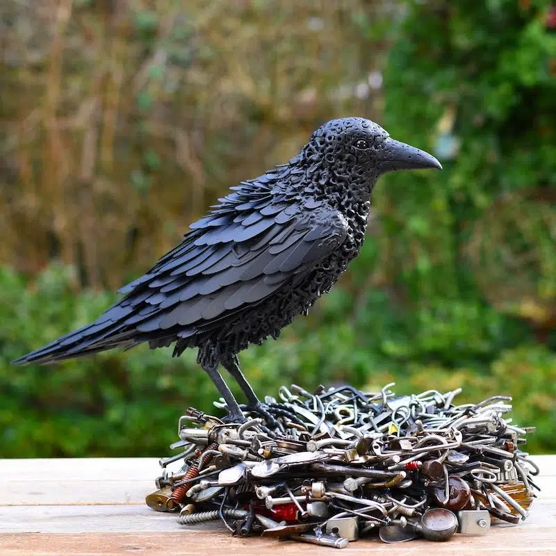 Sculpture of a raven with its nest by Brian Mock