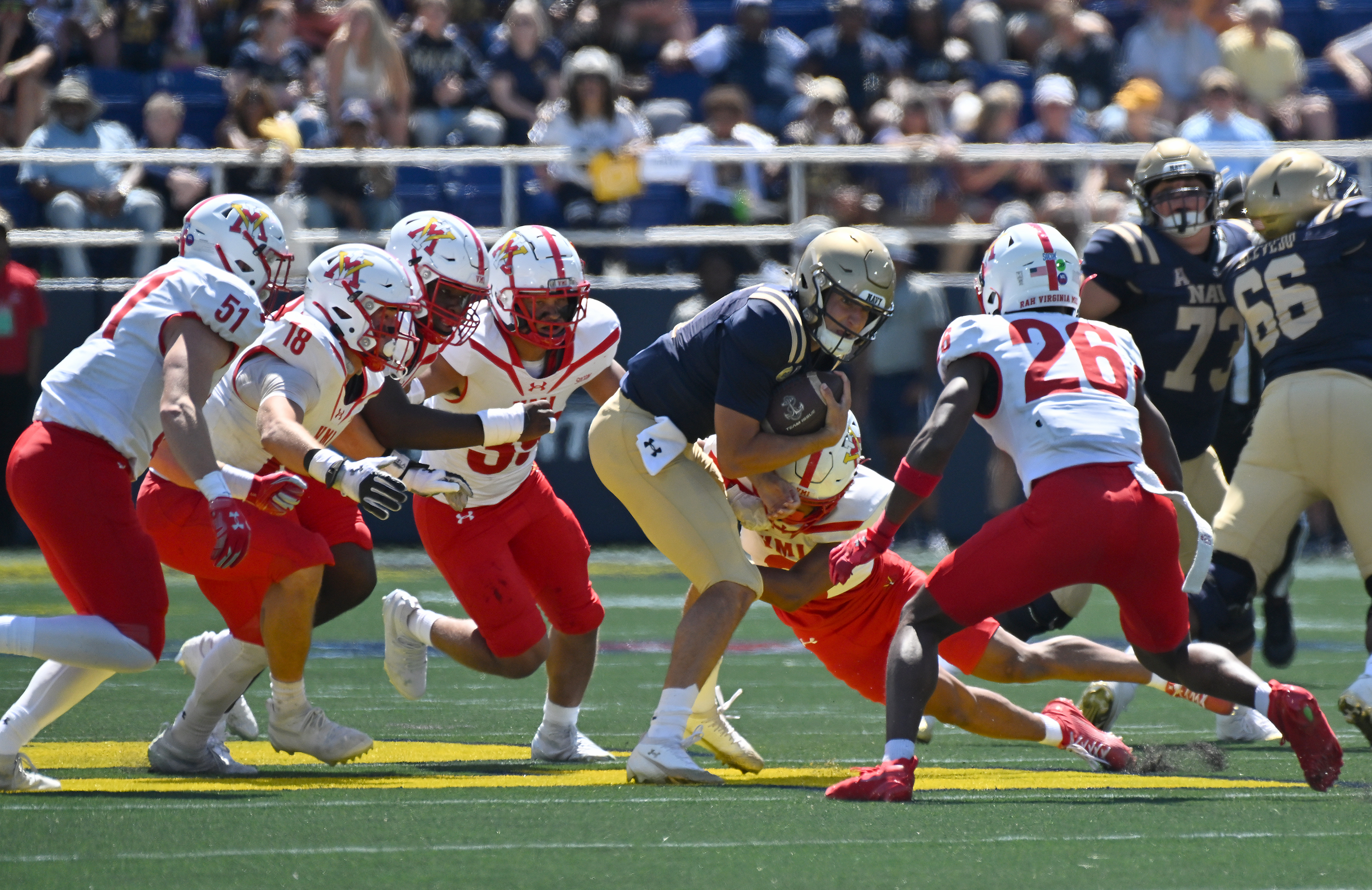 Navy quarterback Blake Horvath gains nine-yards on a run in the first quarter. The Navy Midshipmen play their NCAA football season opener at home against the visiting VMI Keydets at Navy-Marine Corps Memorial Stadium in Annapolis. (Paul W. Gillespie/Staff)