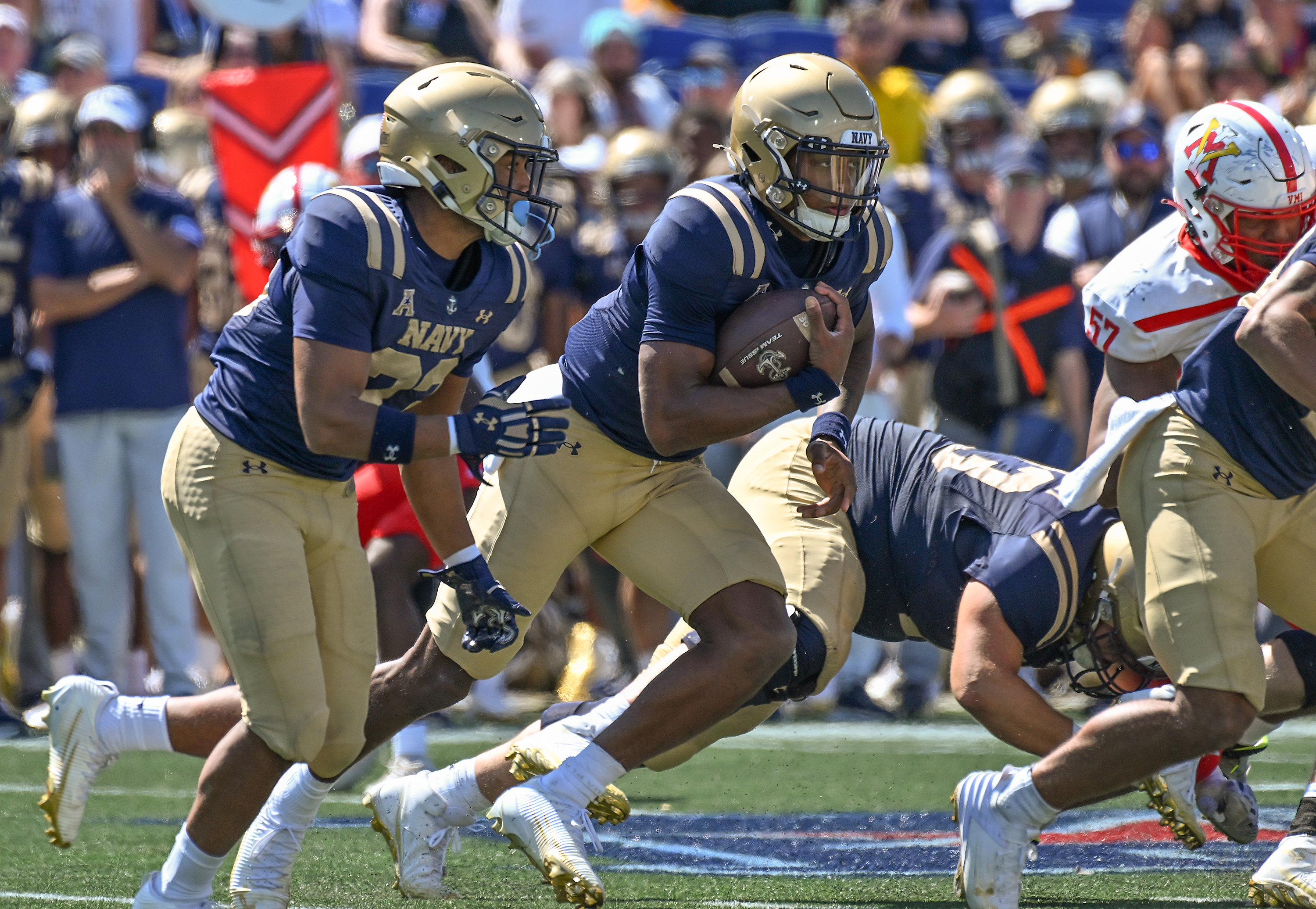 Navy backup quarterback Braxton Woodson gains yards on a run in the third quarter. The Navy Midshipmen win their NCAA football season opener at home against the visiting VMI Keydets, 52-7, at Navy-Marine Corps Memorial Stadium in Annapolis. (Paul W. Gillespie/Staff)