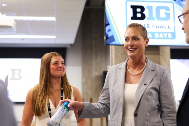 Penn State volleyball player Gillian Grimes, left, stands with her head coach Katie Schumacher-Cawley as they chat with members of the media during Big Ten Volleyball Media Days in the Big Ten Network studios in River North on Monday, July 28, 2025. (Eileen T. Meslar/Chicago Tribune)