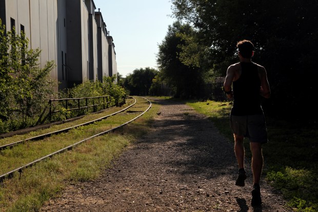 A runner takes advantage of the quiet and unpopulated elevated...