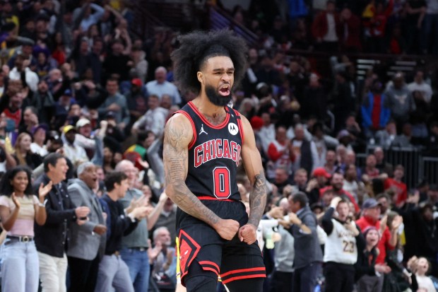 Bulls guard Coby White celebrates after hitting a three-point shot with six seconds to go in the game against the Lakers at the United Center in Chicago on March 27, 2025. The Bulls won 119-117. (Terrence Antonio James/Chicago Tribune)