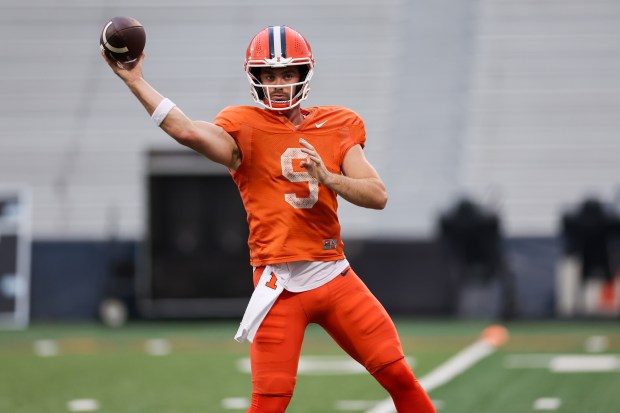 Illinois quarterback Luke Altmyer throws a pass during practice at Memorial Stadium on Aug. 7, 2025, in Champaign. (Armando L. Sanchez/Chicago Tribune)