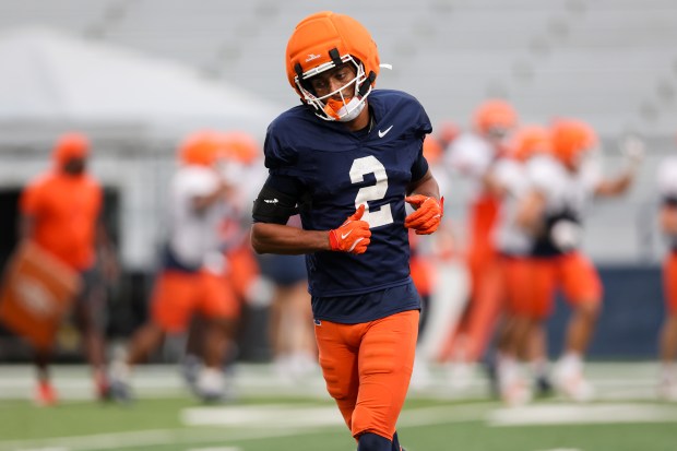 Illinois wide receiver Ashton Hollins runs on the field during practice at Memorial Stadium on Aug. 7, 2025, in Champaign. (Armando L. Sanchez/Chicago Tribune)
