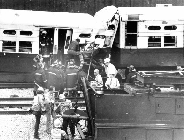 Chicago Fire Department rescuers work to remove the injured from two rapid transit trains that collided near Montrose Avenue Station on Aug. 17, 1984. (Quentin Dodt/Chicago Tribune)