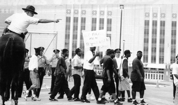 Police direct protesters on West Adams Street on Aug. 18, 1994, when about 1,000 demonstrated outside an opening event at the new United Center. Protesters wanted more jobs to go to minorities. (Chuck Berman/Chicago Tribune)