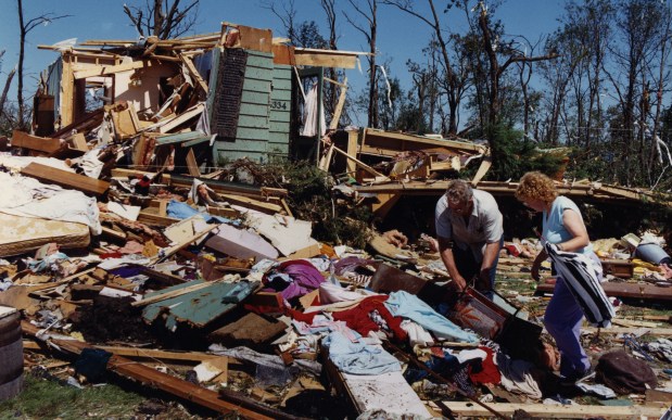 Hazel and Randall Stark pick through the remains of their house in Plainfield, Ill., on Aug. 29, 1990, the day after an EF5 tornado devastated the community. (Don Casper/Chicago Tribune)