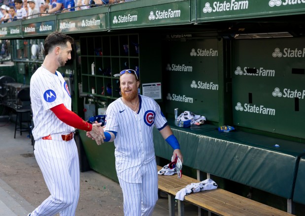 Chicago Cubs pinch hitter Justin Turner, right, and teammate Kyle Tucker celebrate Turner's walk-off home run to defeat the Baltimore Orioles, 5-3, on Sunday, Aug. 3, 2025, at Wrigley Field. (Brian Cassella/Chicago Tribune)