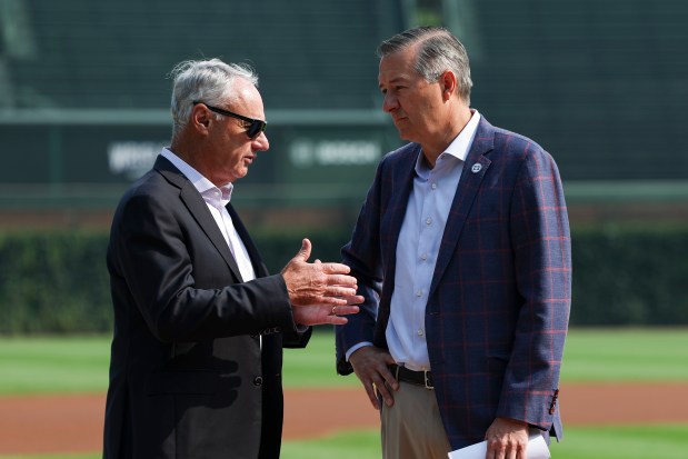 MLB Commissioner Rob Manfred, left, speaks to Cubs Chairman Tom Ricketts on Friday, Aug. 1, 2025, at Wrigley Field before a ceremony announcing the ballpark will host the 2027 All-Star Game. (Eileen T. Meslar/Chicago Tribune)