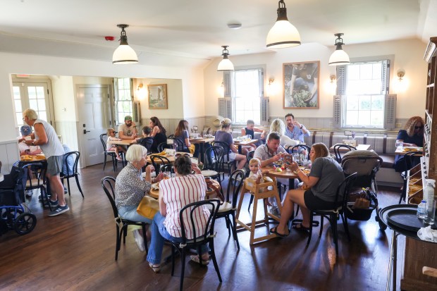 People eat lunch at the Elawa Cafe at Elawa Farm...