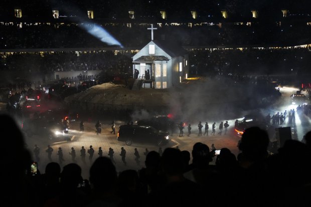 Fans watch Kanye West during "The Donda Experience" listening party at Soldier Field on Aug. 26, 2021 in Chicago. (Armando L. Sanchez/Chicago Tribune)