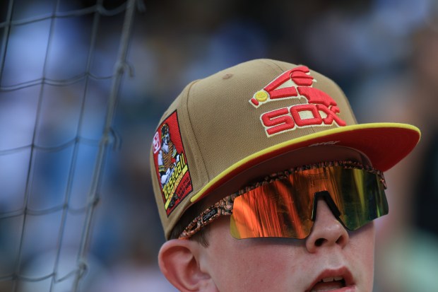 A fan wears a White Sox cap to a game between the Savannah Bananas and Firefighters on Aug. 15, 2025, at Rate Field. (John J. Kim/Chicago Tribune)