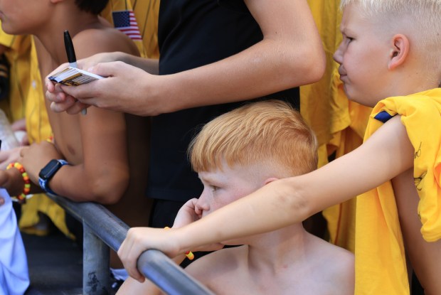 Young fans wait for player autographs before a game between the Savannah Bananas and Firefighters on Aug. 15, 2025, at Rate Field. (John J. Kim/Chicago Tribune)