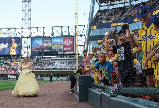 Fans wait for player autographs before a game between the Savannah Bananas and Firefighters on Aug. 15, 2025, at Rate Field. (John J. Kim/Chicago Tribune)